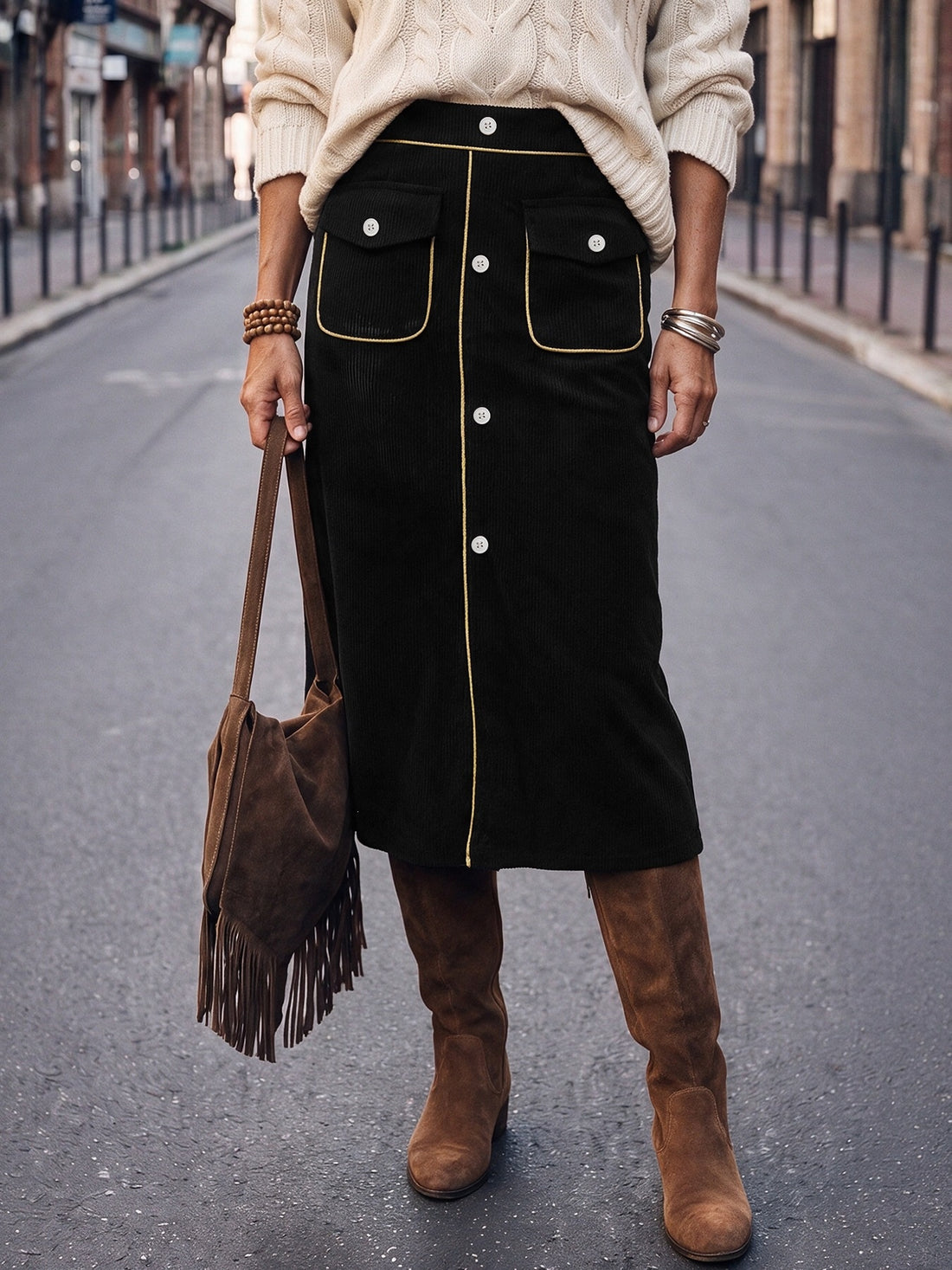 midi skirt in black featuring buttoned and straight fit