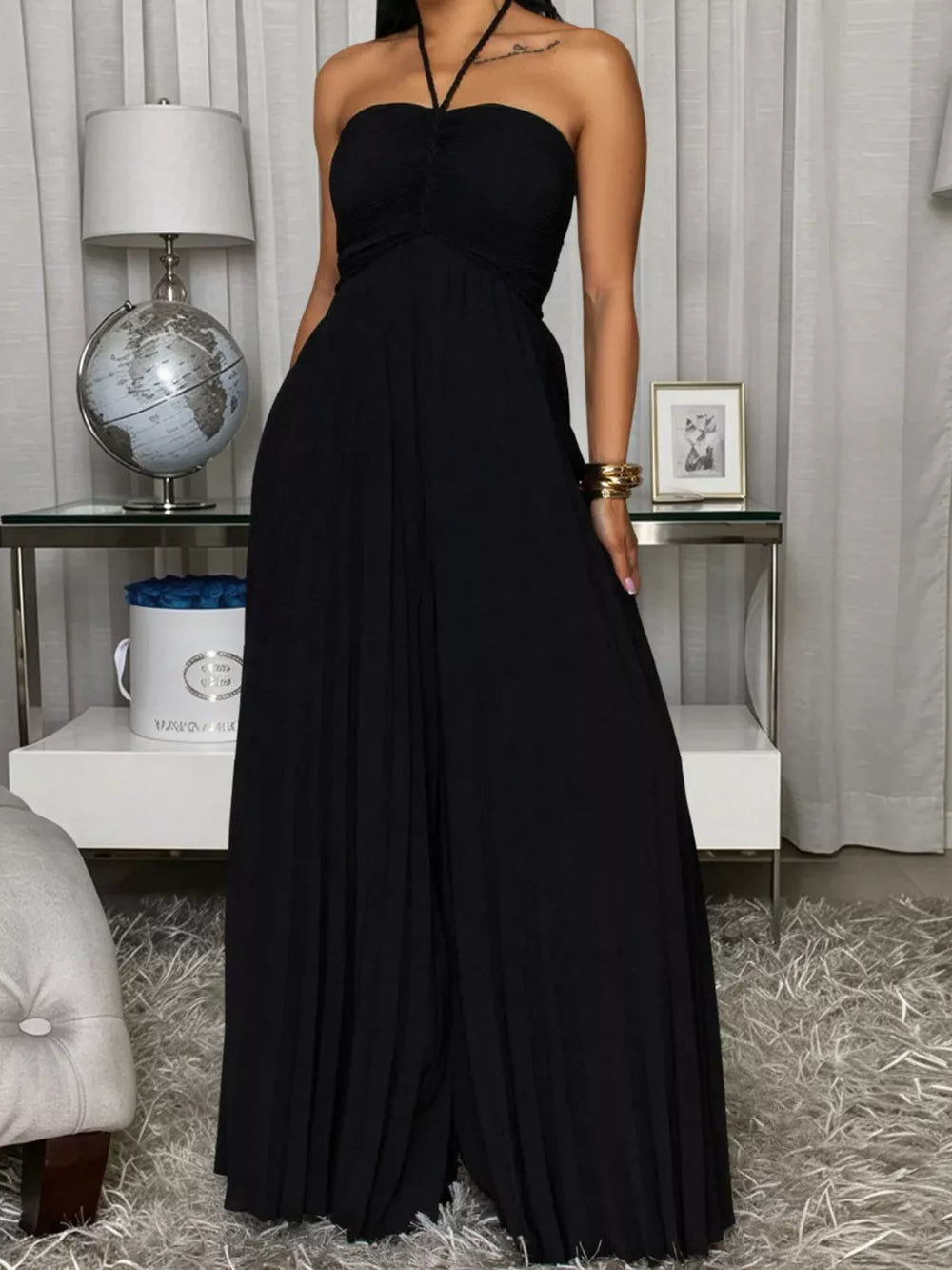 Red jumpsuit featuring pleated and pleated