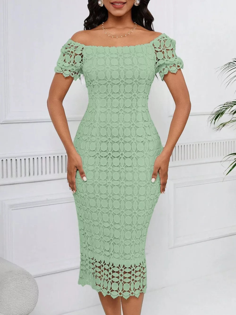 Light green lace midi dress with off-the-shoulder neckline and short puff sleeves.