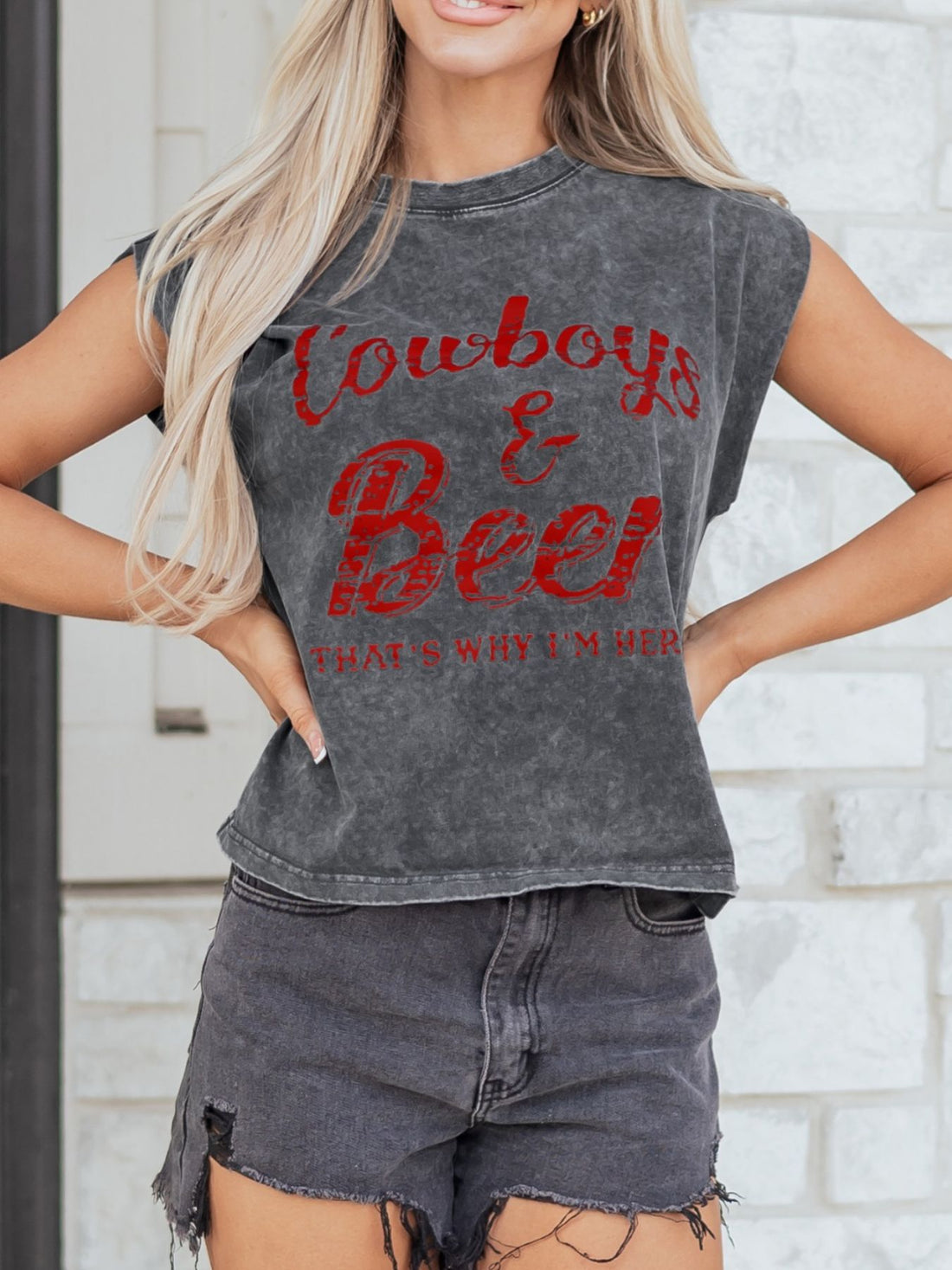 Acid-washed dark gray cotton tank top with red Cowboys & Beer graphic and raw hem.