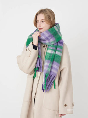Textured plaid fringe wrap scarf in purple, green, and white.