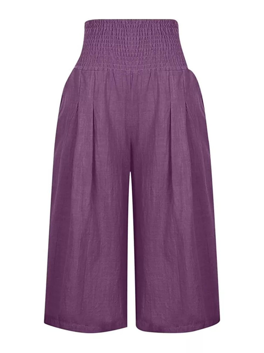 Purple linen culottes with smocked high waist and wide legs.
