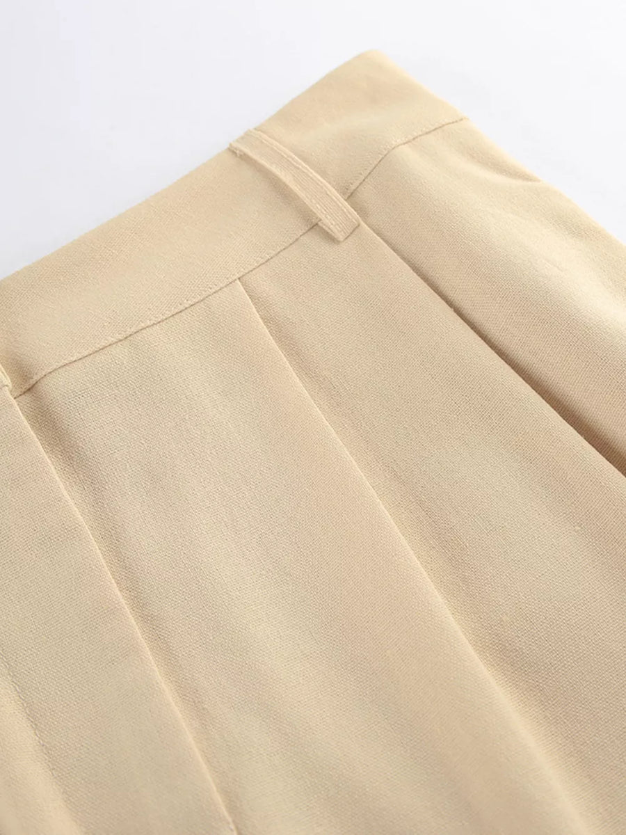 two-piece set in light beige with tied waist and full-length