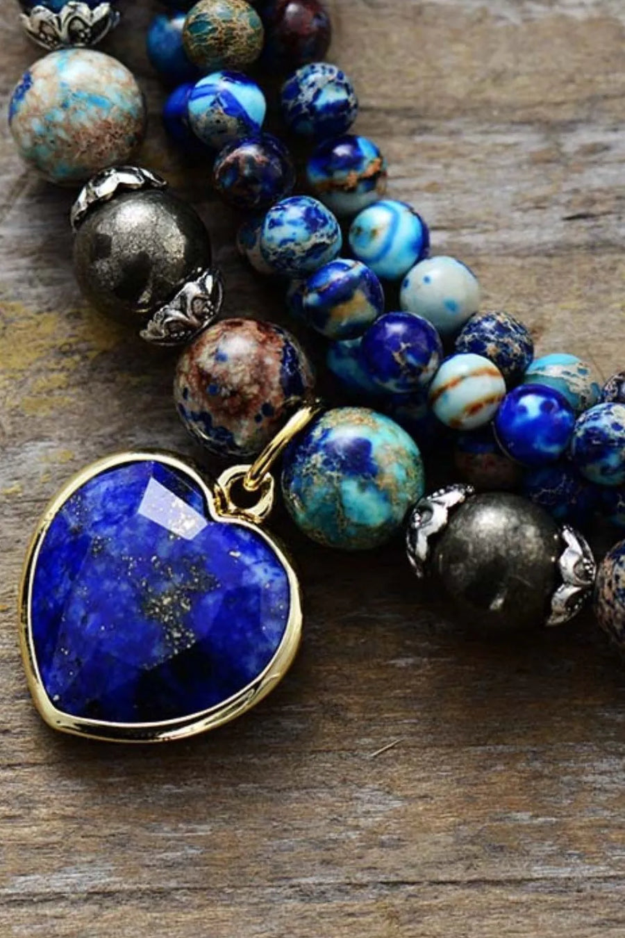 Royal blue heartstone wrap bracelet with assorted blue and earth-toned beads.