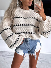 Geometric stripe oversized knit sweater in cream with black detail, crew neck, and balloon sleeves.