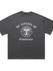 Grey oversized graphic t-shirt with vintage-inspired print and short sleeves.