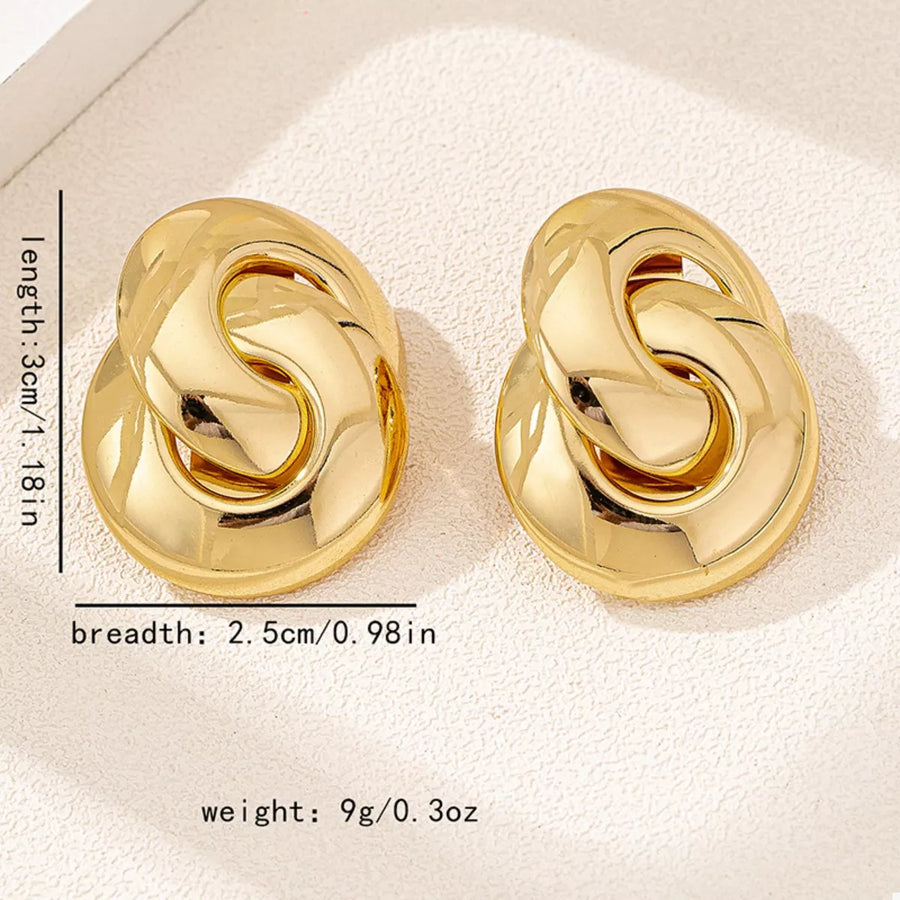 Chunky knot gold-plated earrings with oval base and interlocking chain detail.