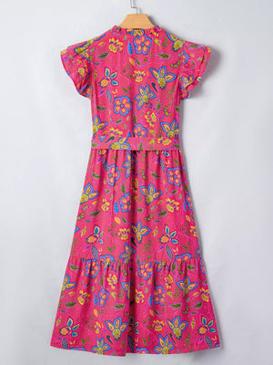 Floral midi dress with ruffled sleeves in cotton blend, featuring a tiered skirt and vibrant floral print.