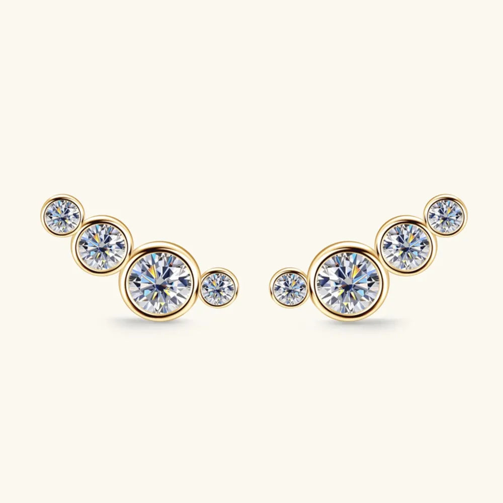Gold ear climbers with a cluster of five round clear crystals on each earring.