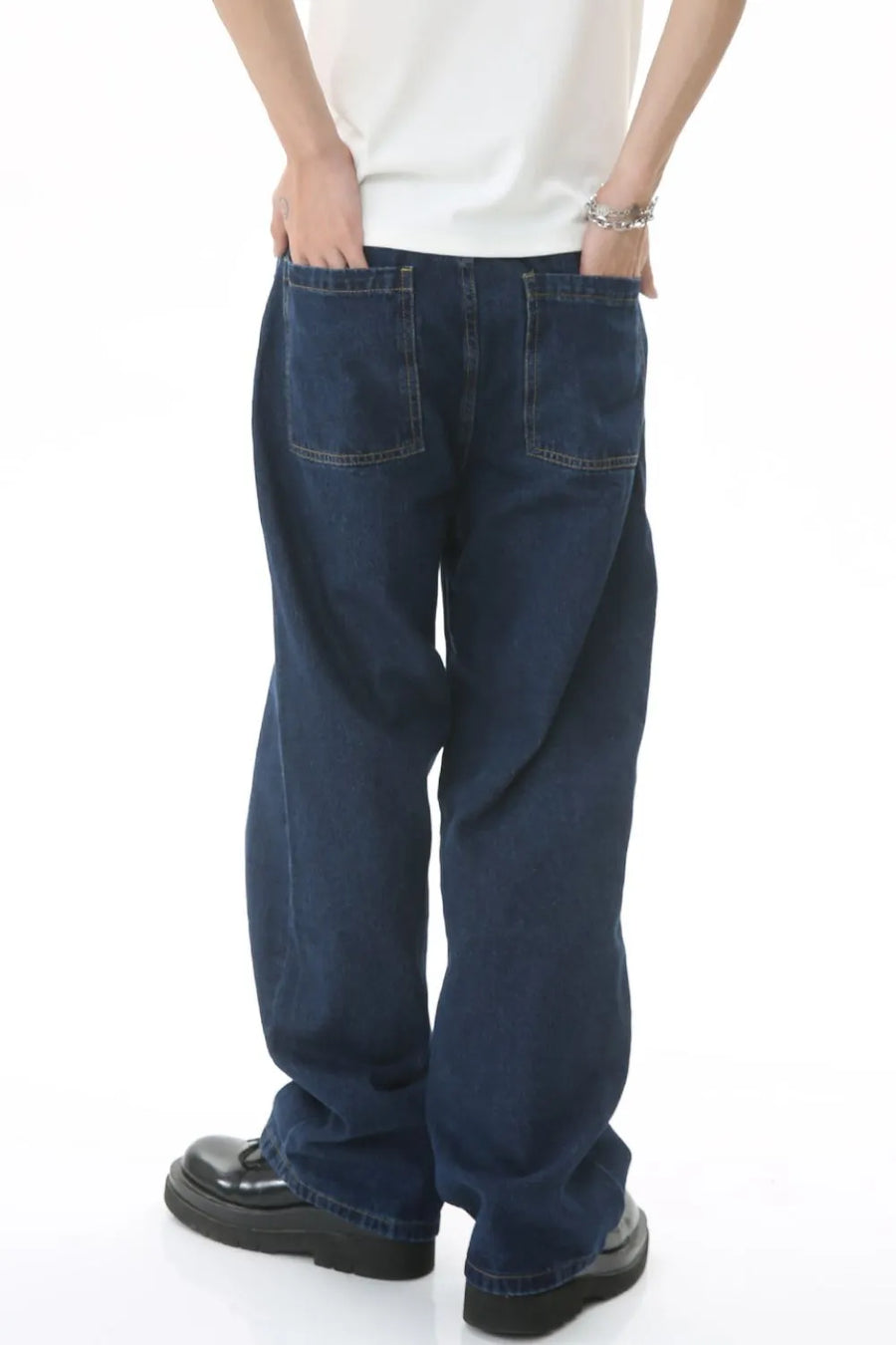 Baggy dark wash denim jeans with subtle flare and two back pockets.