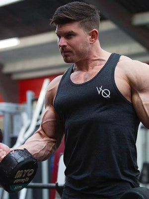 Men's dark gray racerback tank top with roundneck and white logo detail.