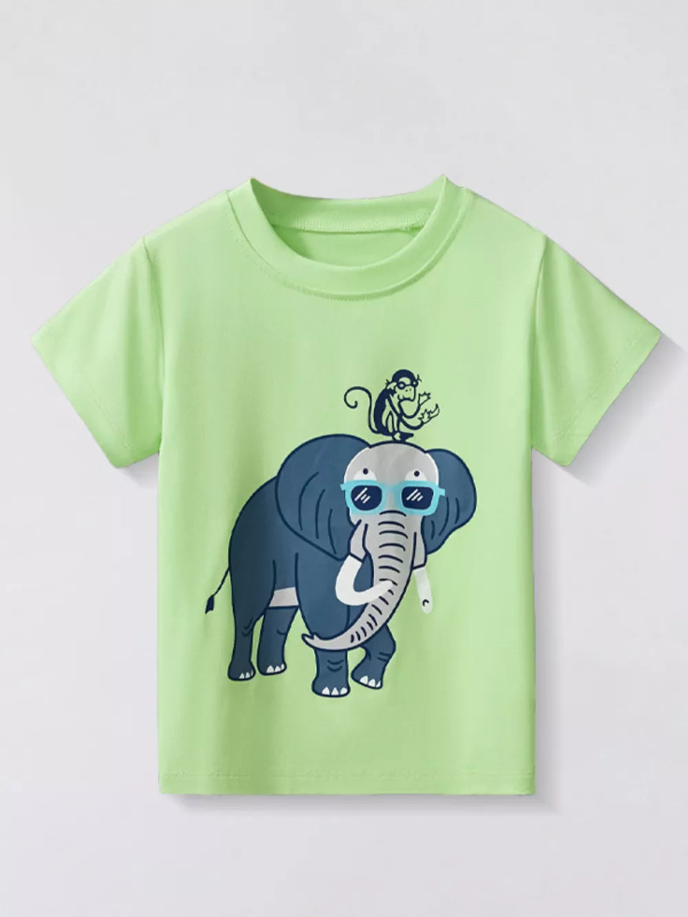 Light green t-shirt with a graphic print of a blue elephant wearing sunglasses and a monkey on its head.