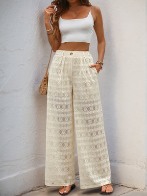 Cream lace palazzo trousers with button detail and wide leg.