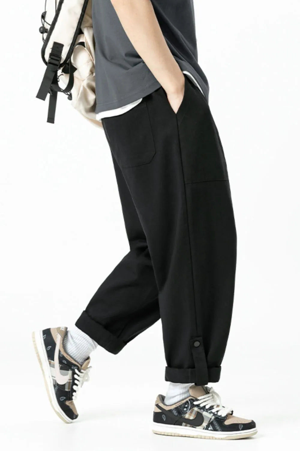 Black relaxed fit cuffed cargo trousers with button detail at ankle