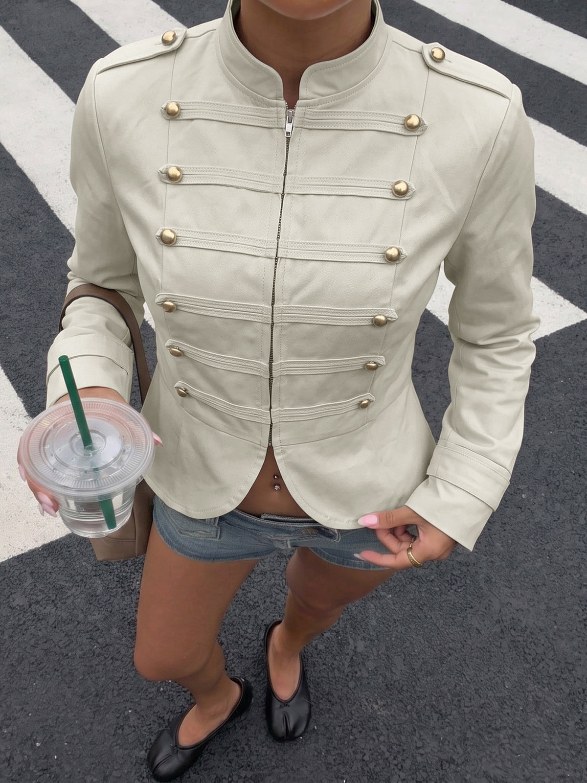 jacket in ivory featuring decorative buttons and fitted fit