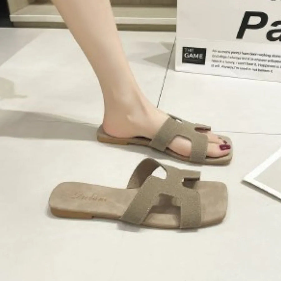 H-strap suede slider sandals in beige with a square toe.
