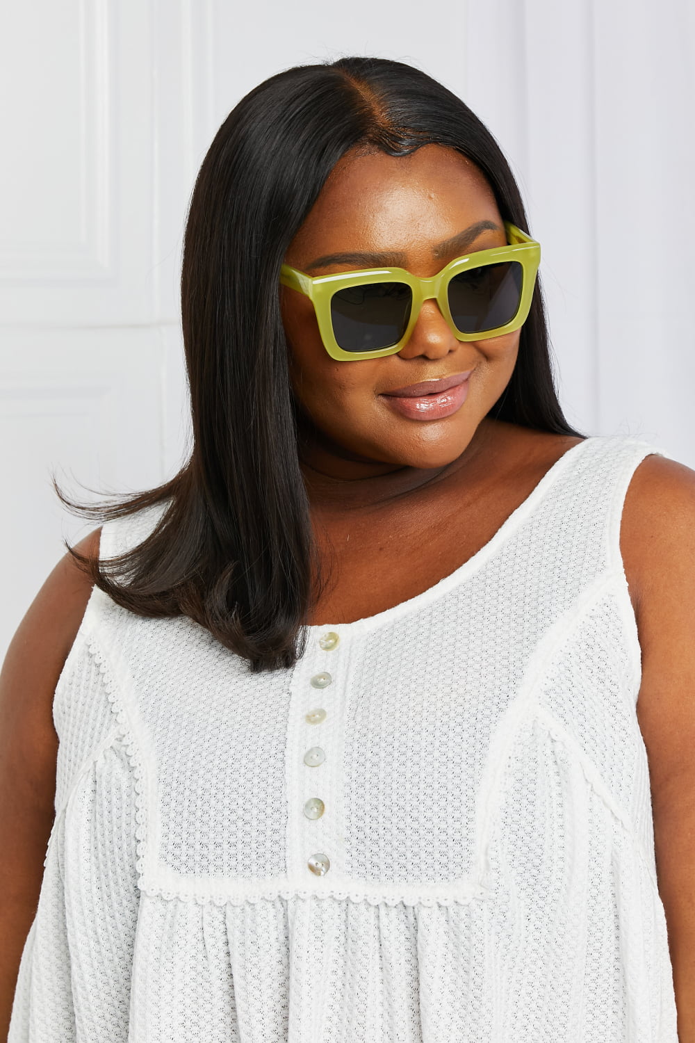 Citron box frame sunglasses with thick acetate rims and dark lenses.