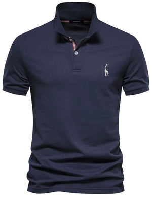 Navy piqué polo shirt with giraffe embroidery and striped collar detail.