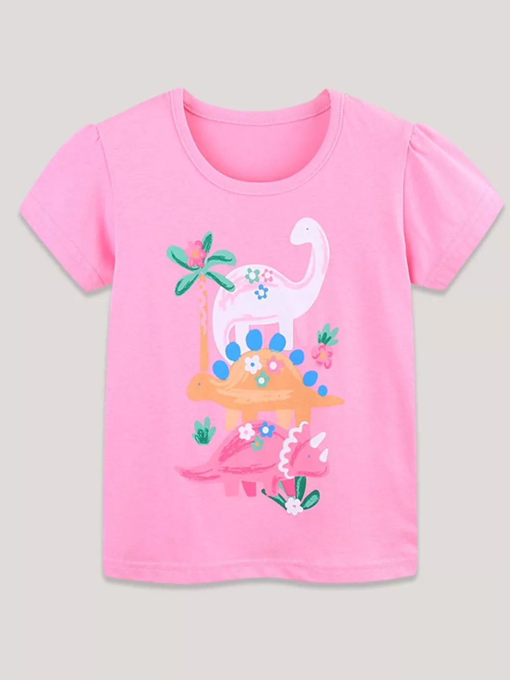 Pink cotton crew neck t-shirt with playful dinosaur print and puff sleeves.