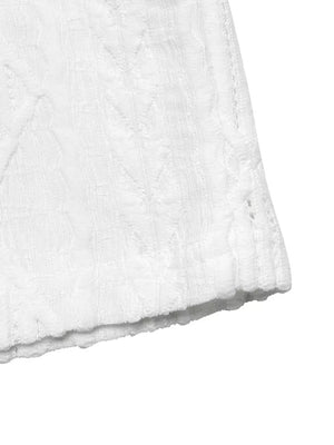 White textured knit maternity t-shirt with cable detail and raw hem.