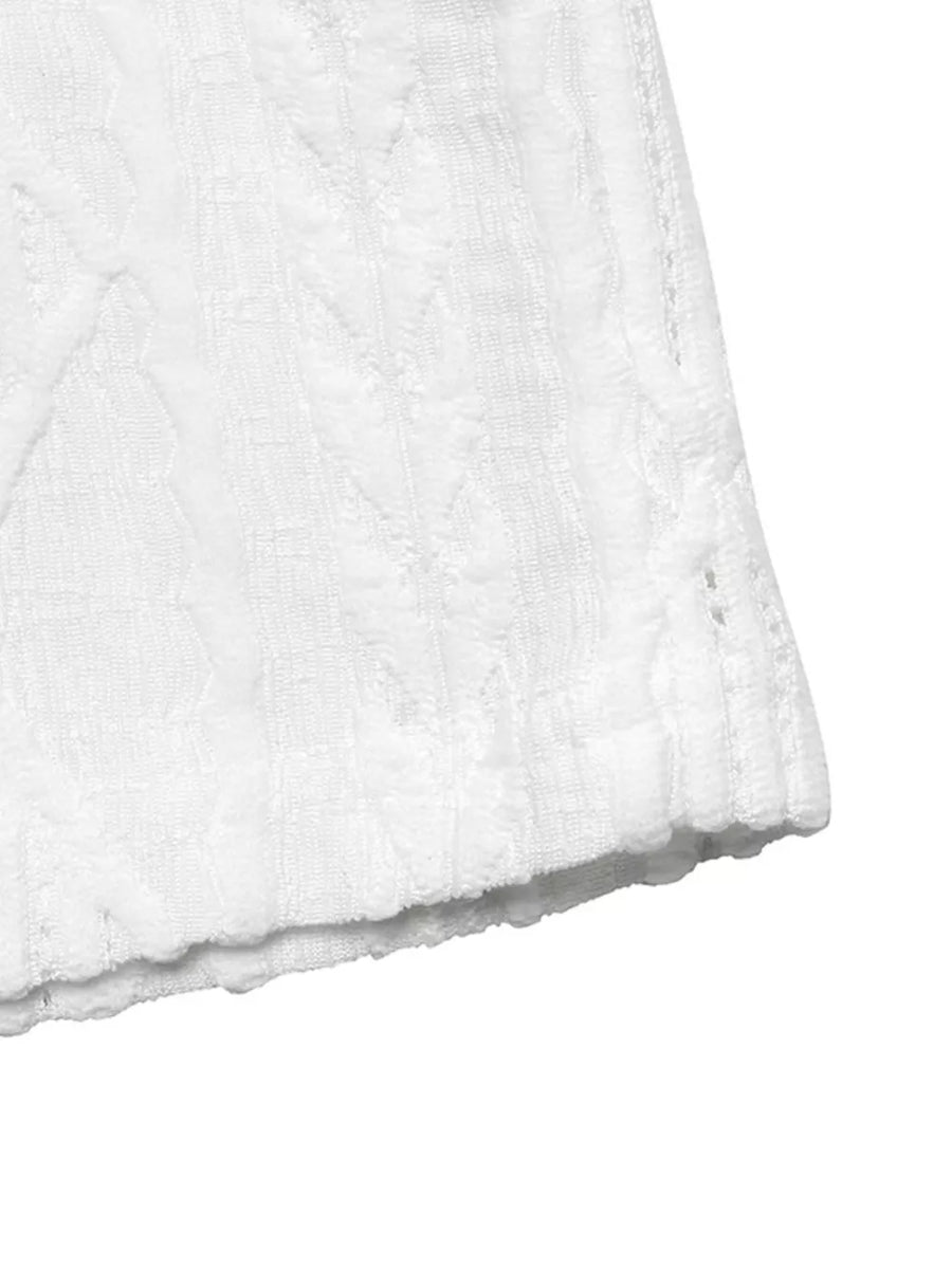 White textured knit maternity t-shirt with cable detail and raw hem.