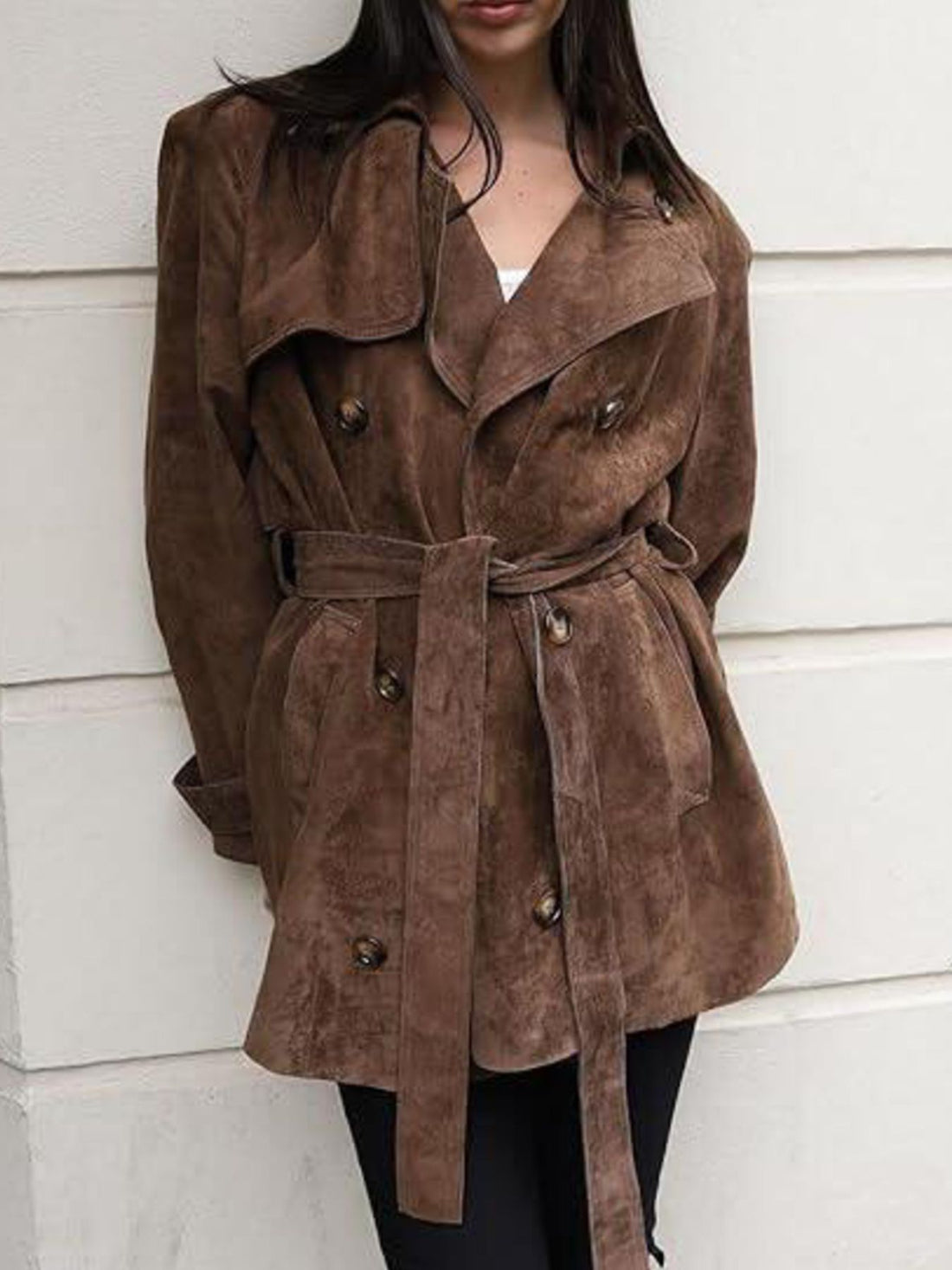 Elegant dark brown belted double-breasted trench coat with cuffed sleeves and a tie waist.
