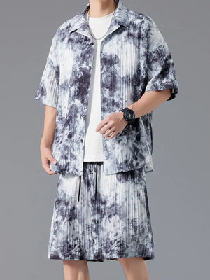 Men's tie-dye pleated casual set in dark navy with short sleeves and button-up shirt.