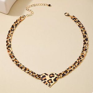 black necklace featuring heart pendant and leopard-print