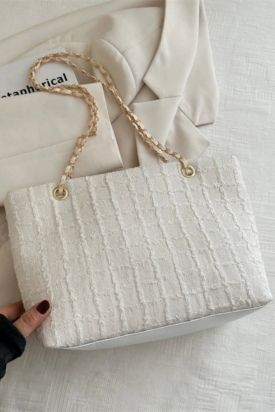 White textured bouclé shoulder bag with gold chain strap