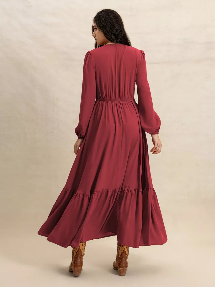 Burgundy plus-size maxi dress with balloon sleeves, elastic waist, and tiered ruffle hem.