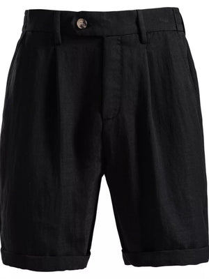 Black pleated chino shorts with button closure and cuffed hems.