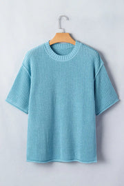Relaxed ribbed knit sweater top in light blue with short sleeves and crew neck.