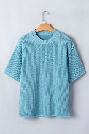Relaxed ribbed knit sweater top in light blue with short sleeves and crew neck.