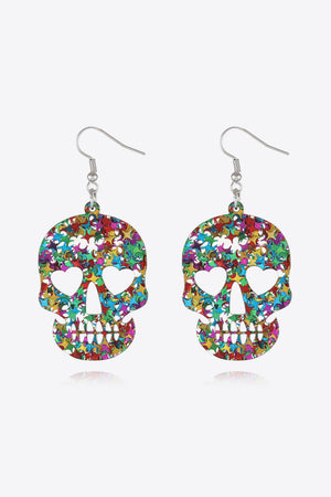 Glitter skull starburst dangle earrings with heart eye cutouts in multicolor acrylic.
