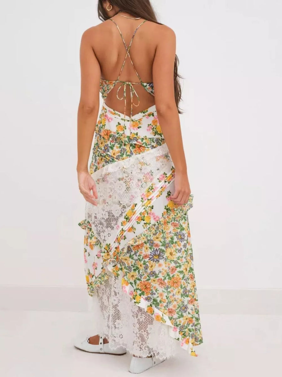 Floral lace maxi dress with ruffles and a tie-back detail.