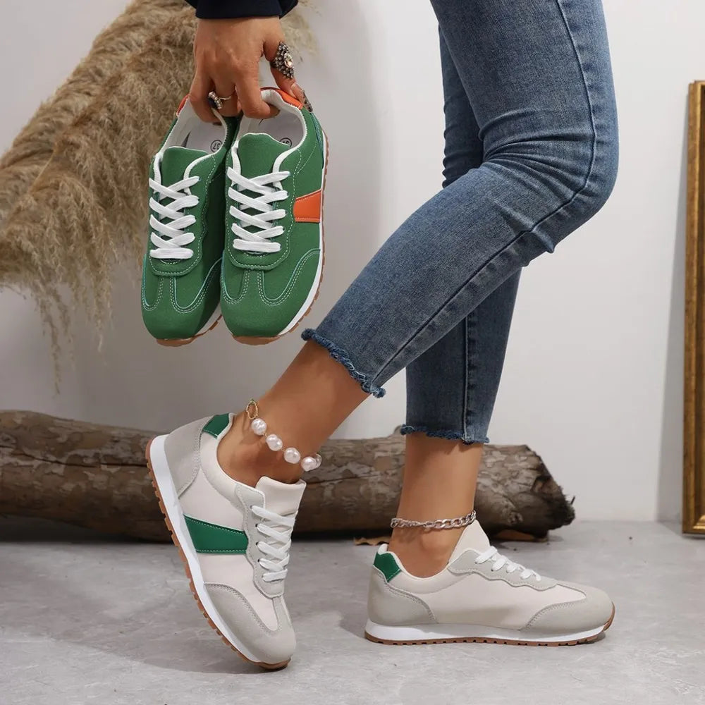 Retro-inspired suede and canvas sneakers in beige and green with white laces.