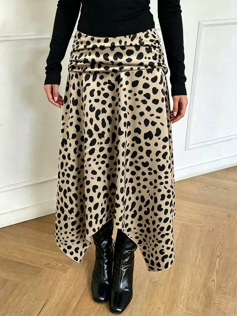 Leopard print midi skirt with asymmetrical hem and ruched waist detail.