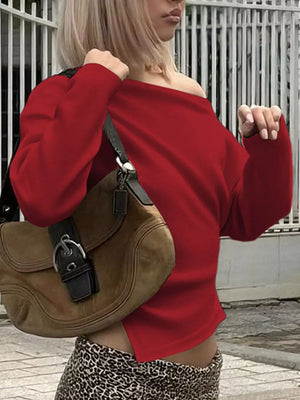 Red draped asymmetrical off-shoulder t-shirt with long sleeves and a casual cut.
