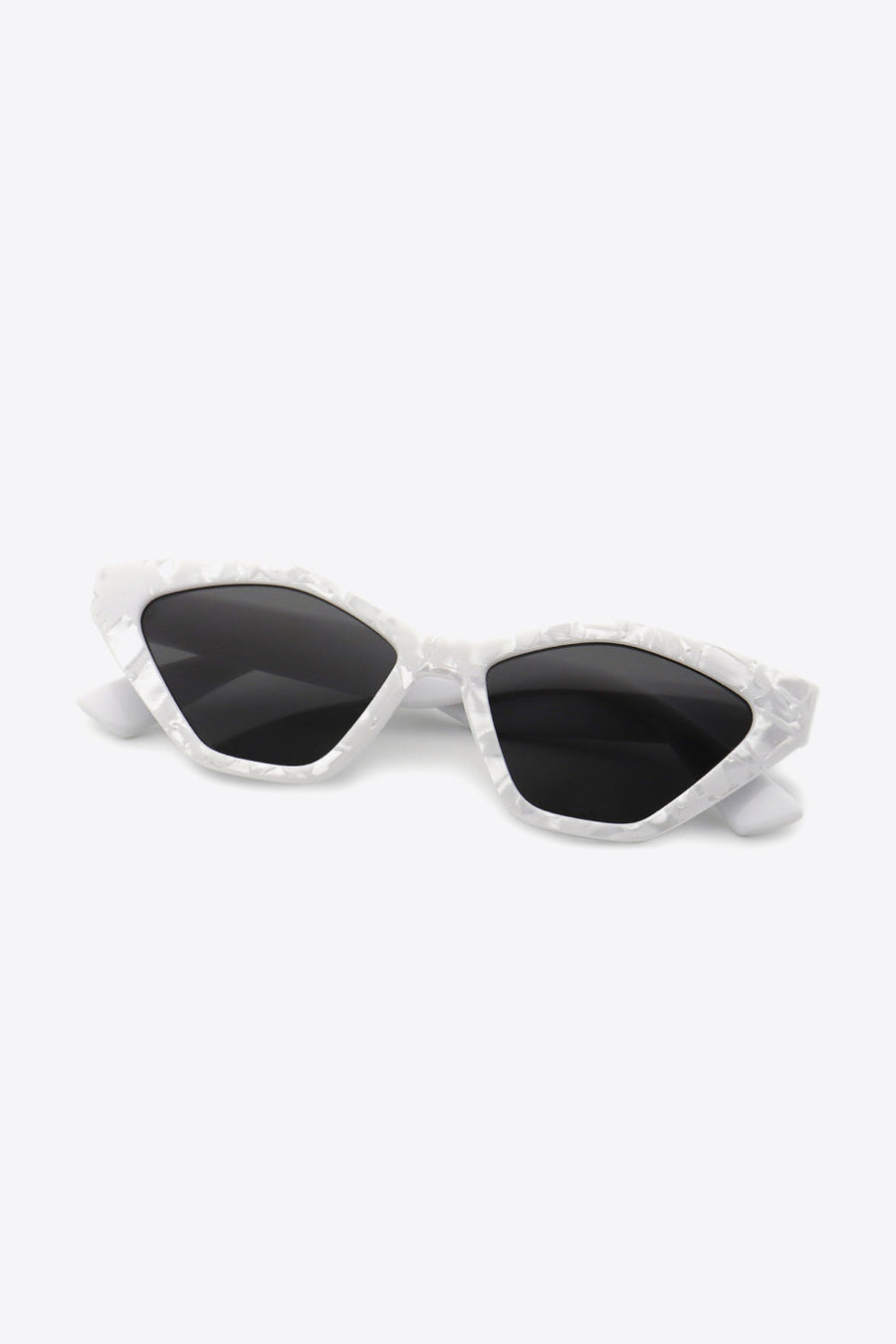 Geometric cat-eye sunglasses in light gray marble pattern with black lenses.