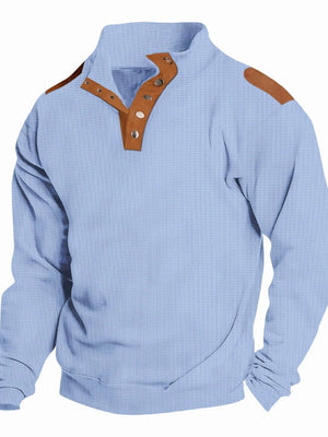 Light blue waffle knit henley shirt with suede shoulder patches and button collar.