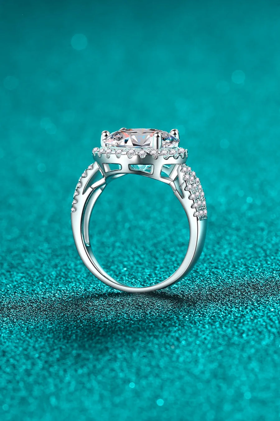 Silver halo moissanite ring with sculpted band and pavé accents
