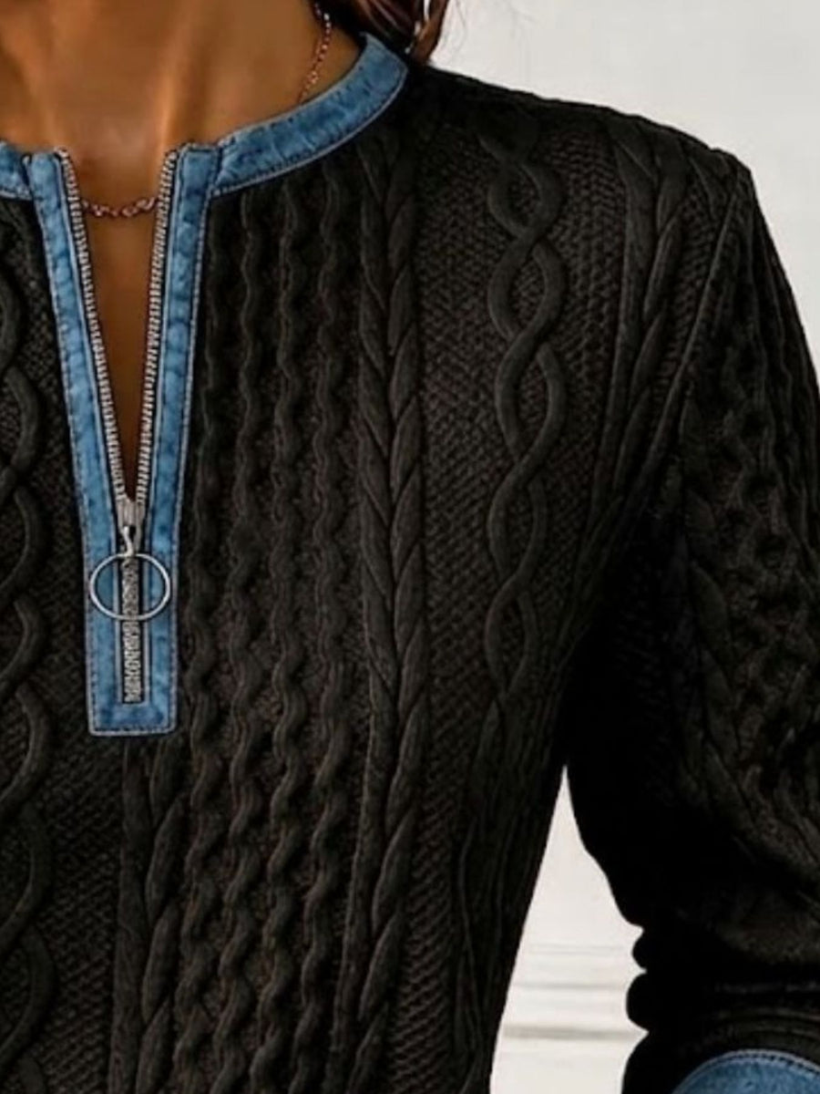 White sweatshirt featuring contrast stitching and cable knit