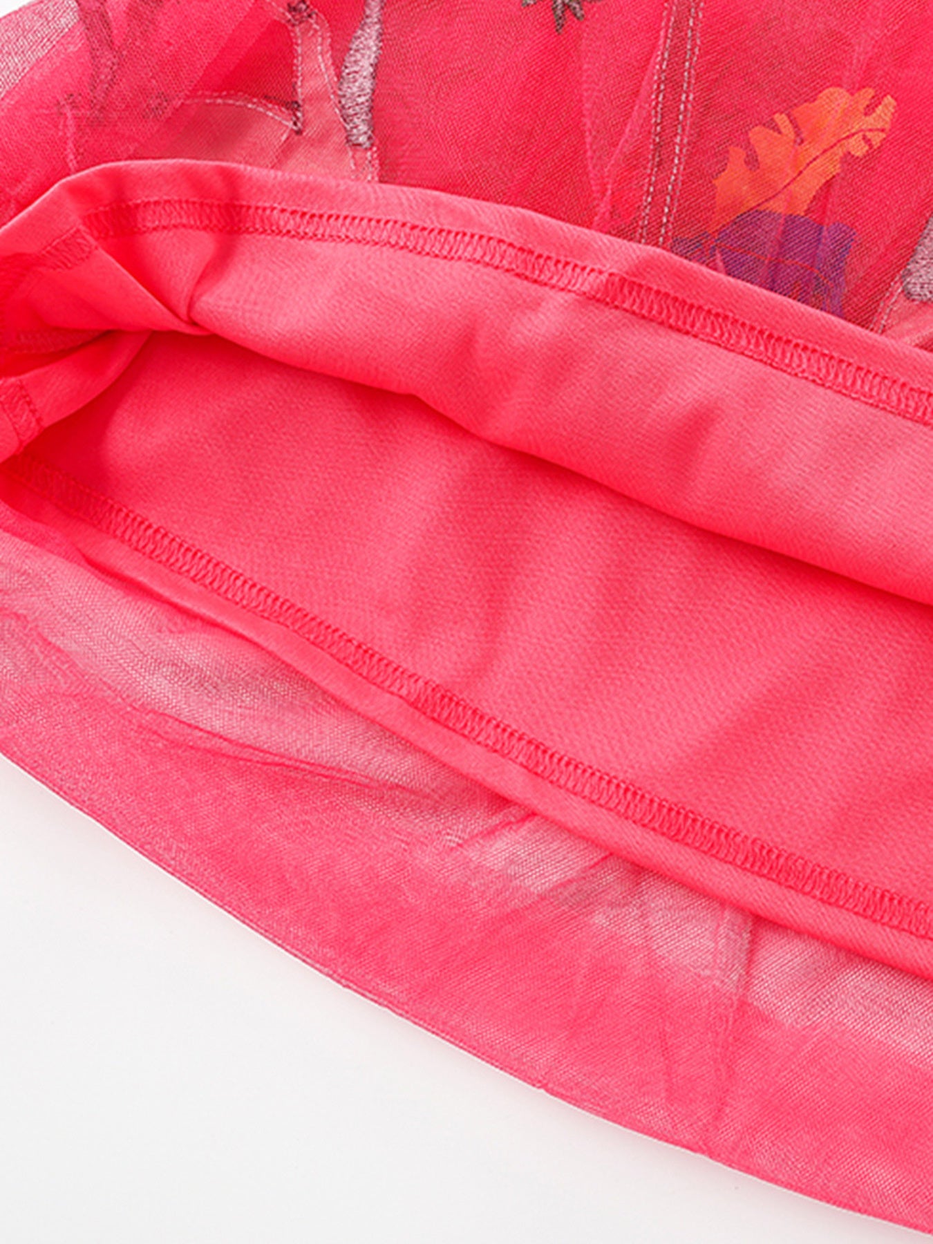 Toddler dress with embroidered elephant detail on pink tulle and cotton lining.