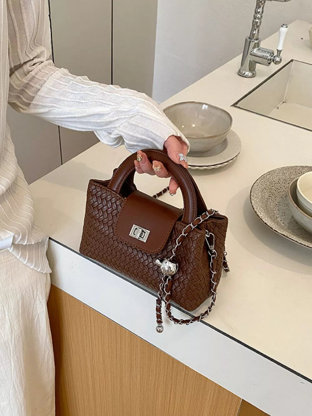 crossbody bag in chocolate brown featuring woven texture and boxy fit