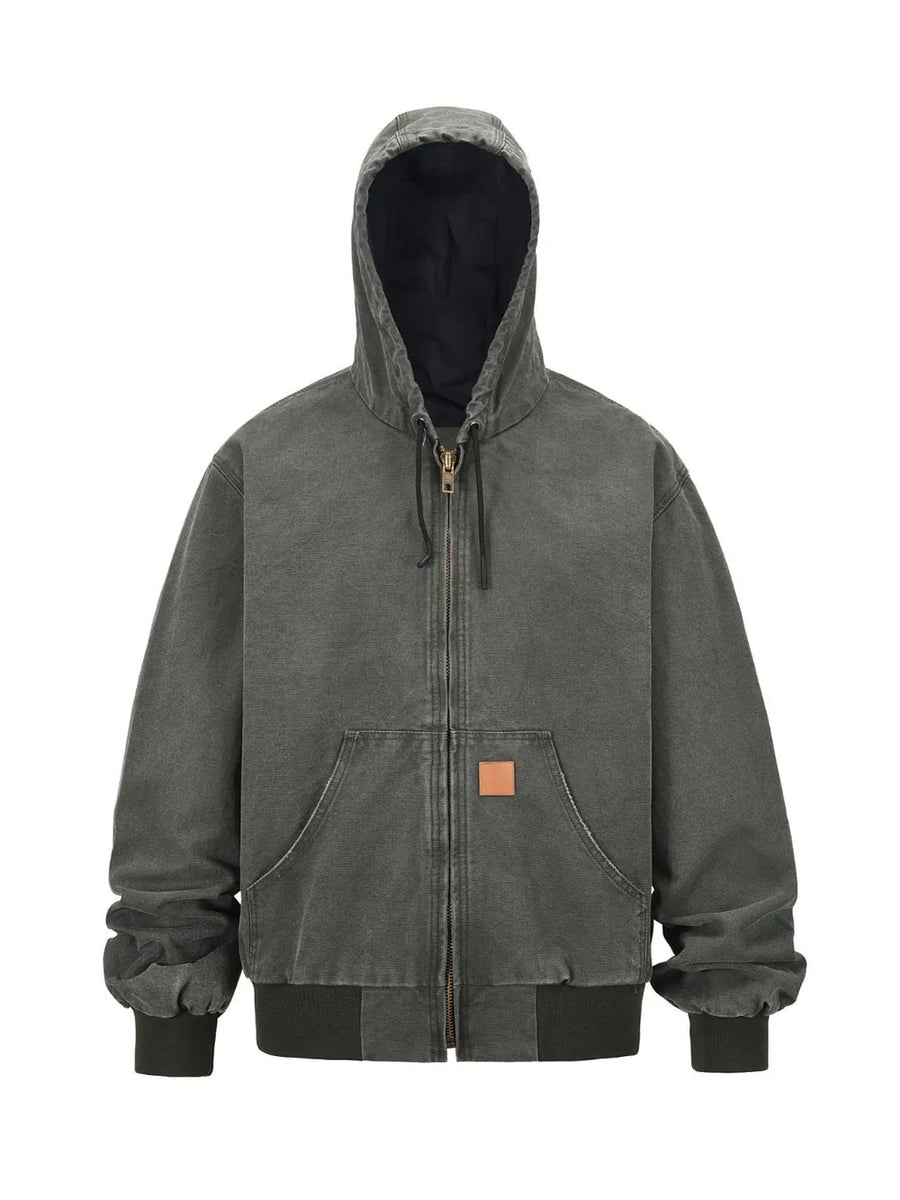 Washed canvas workwear hoodie jacket in charcoal with zip front, hood, and pocket details.