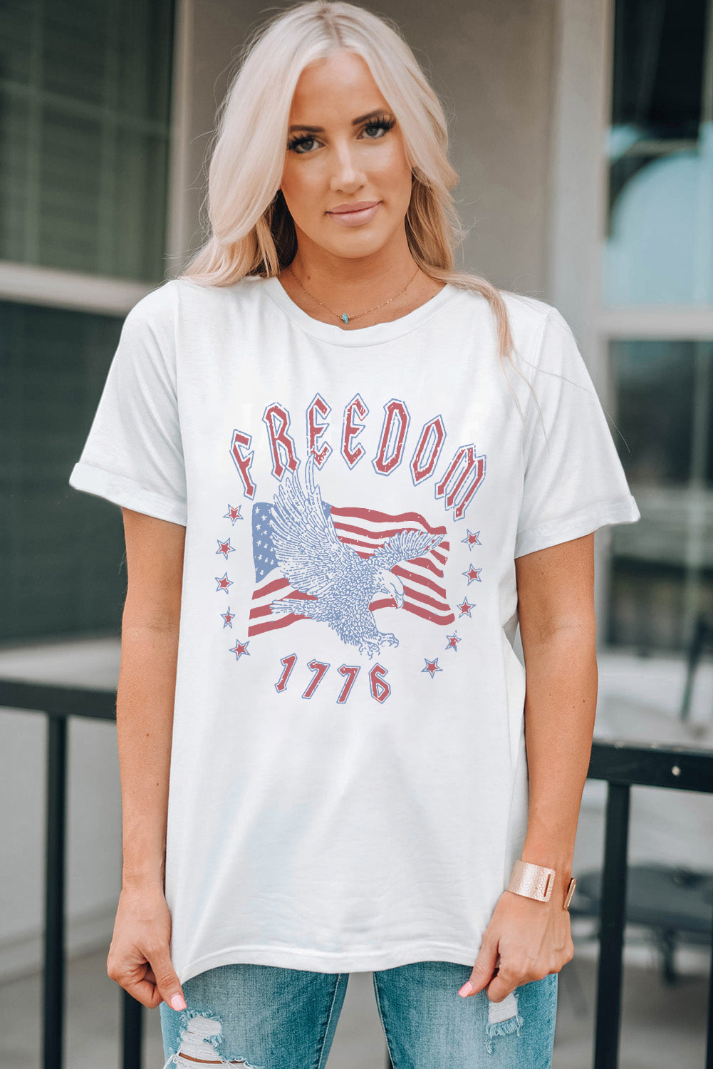 White graphic tee with eagle, American flag, and Freedom 1776 print