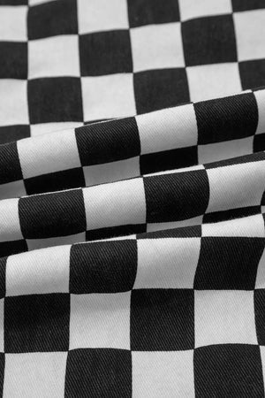 Checkerboard distressed cropped jeans in black and white denim with a classic checkered pattern.