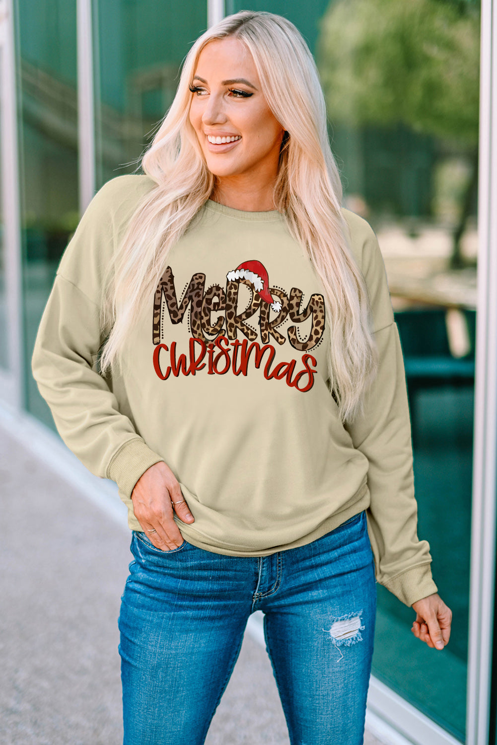 Khaki crewneck sweatshirt with "Merry Christmas" graphic and Santa hat detail