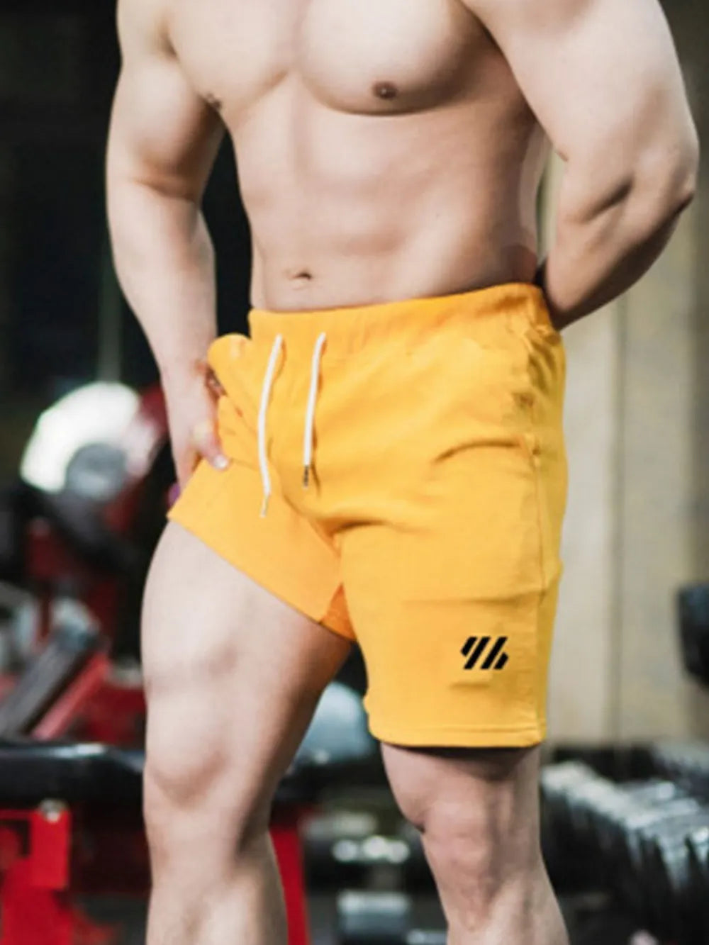 Gold activewear shorts with drawstring and logo detail