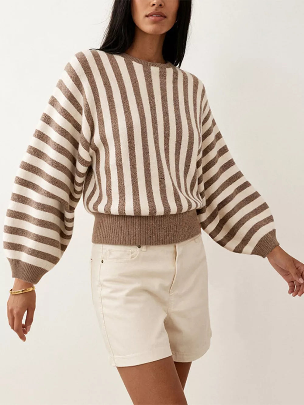 cream crewneck sweater featuring ribbed cuffs and striped